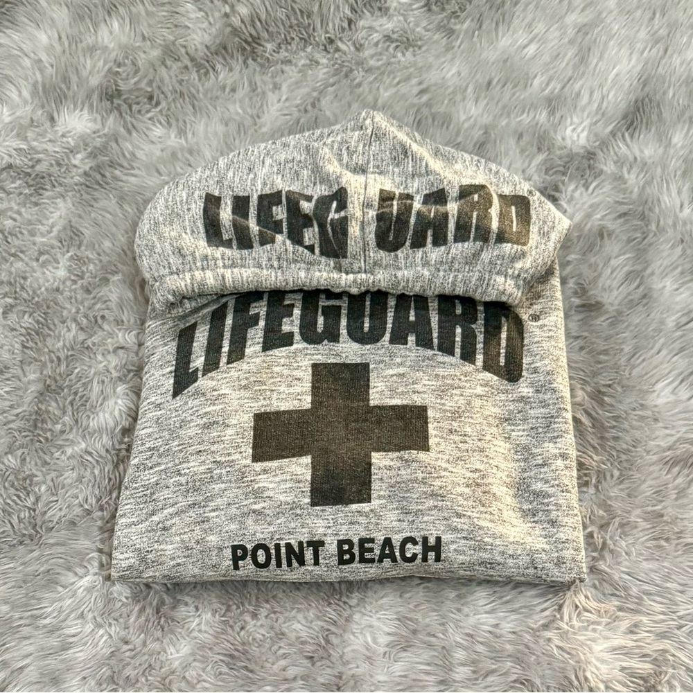 Sweatshirt: life guard logo.